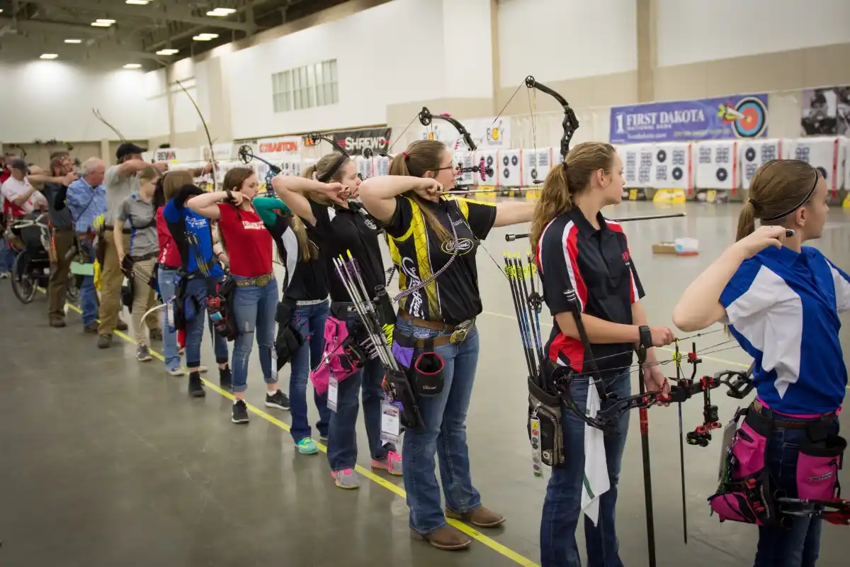 Line of archers at USA Archery Indoor National competition